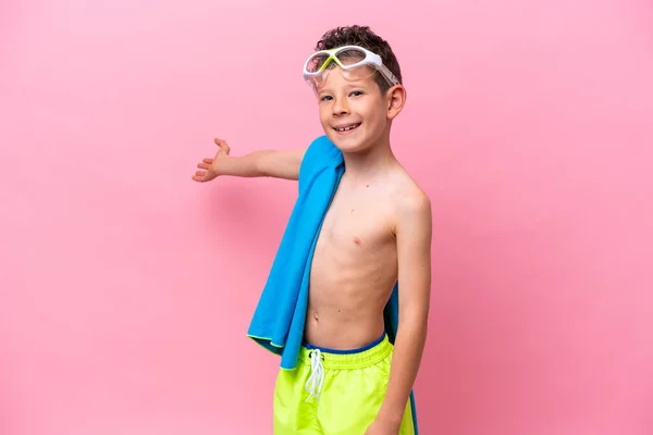 Little Caucasian Boy Wearing Diving Goggles Isolated Pink Background Extending — Stockfoto