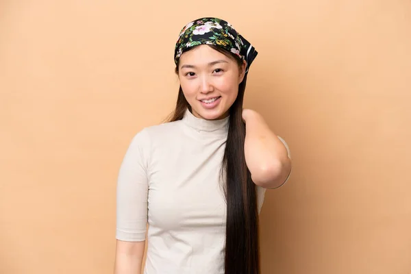 Young Chinese Woman Isolated Beige Background Laughing — Stock Fotó