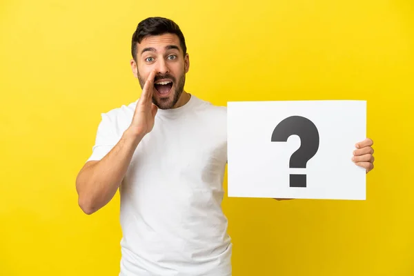Young Handsome Caucasian Man Isolated Yellow Background Holding Placard Question — 스톡 사진