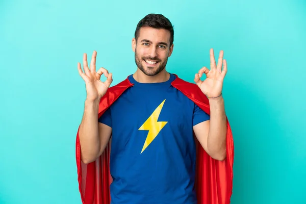 Super Hero Caucasian Man Isolated Blue Background Showing Sign Fingers — Zdjęcie stockowe