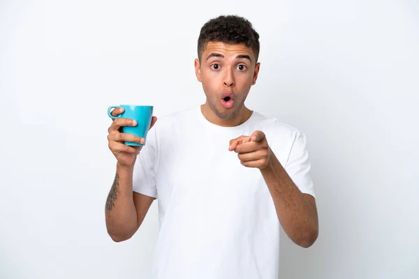 Young Brazilian Man Holding Cup Coffee Isolated White Background Surprised — 图库照片