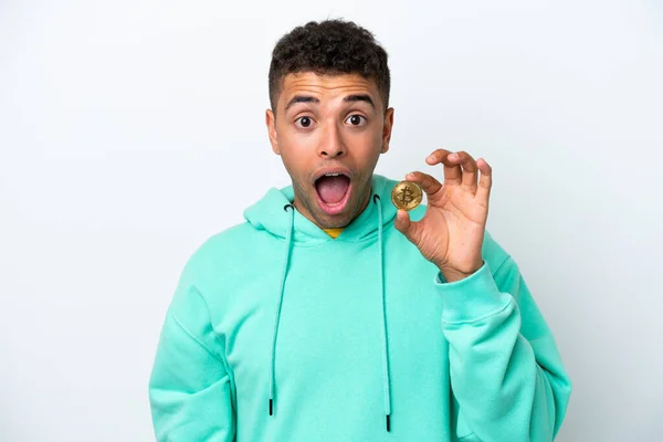 Young Brazilian Man Holding Bitcoin Isolated White Background Surprise Facial — 图库照片