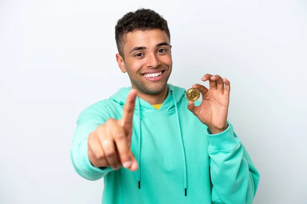 Young Brazilian Man Holding Bitcoin Isolated White Background Showing Lifting — 图库照片