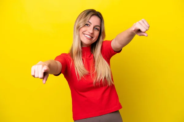 Young Uruguayan Woman Isolated Yellow Background Pointing Front Happy Expression — Foto de Stock
