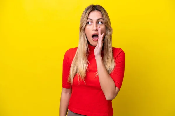 Young Uruguayan Woman Isolated Yellow Background Whispering Something Surprise Gesture — Stock Photo, Image