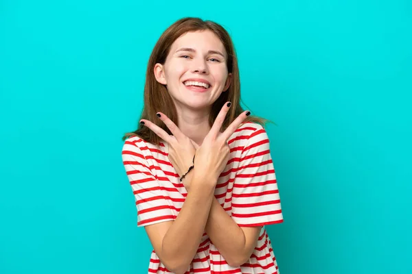 Jong Engels Vrouw Geïsoleerd Blauwe Achtergrond Glimlachen Tonen Overwinning Teken — Stockfoto