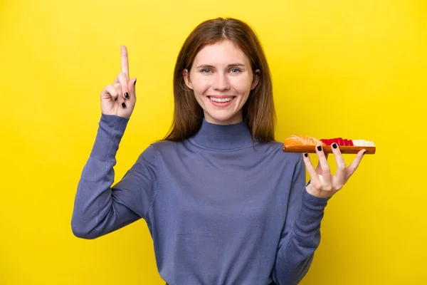 Young English Woman Holding Sashimi Isolated Yellow Background Pointing Great — Stock Fotó