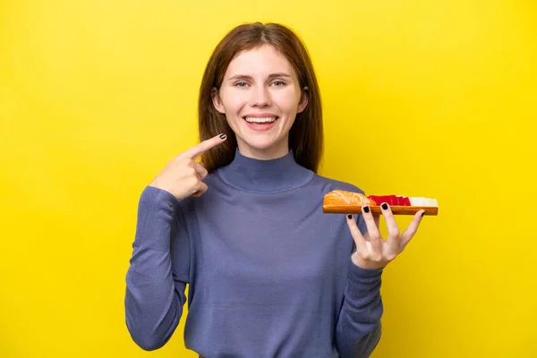 Young English Woman Holding Sashimi Isolated Yellow Background Giving Thumbs — Stock Fotó