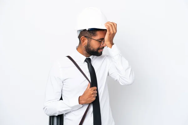 Young architect Brazilian man with helmet and holding blueprints isolated on white background has realized something and intending the solution