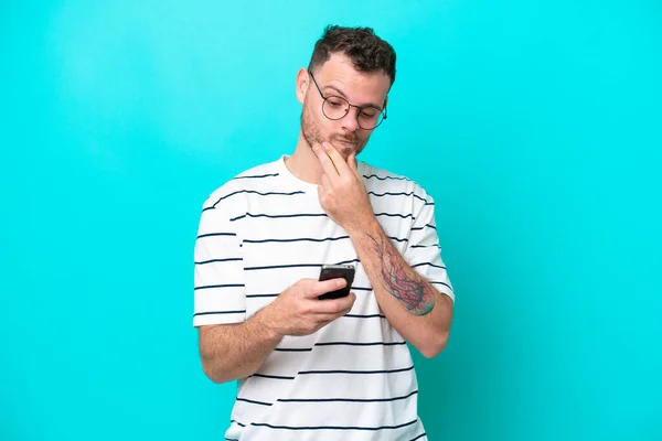 Young Brazilian Man Isolated Blue Background Thinking Sending Message — Stock Photo, Image