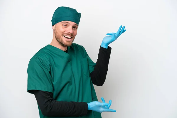 Surgeon Brazilian Man Green Uniform Isolated White Background Extending Hands — Φωτογραφία Αρχείου