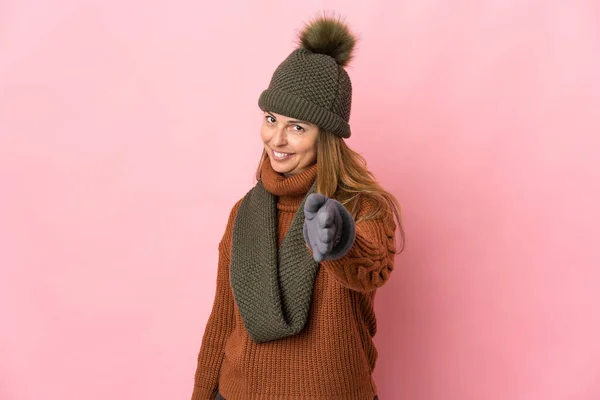 Middle Age Woman Winter Hat Isolated Pink Background Shaking Hands — Stock Photo, Image