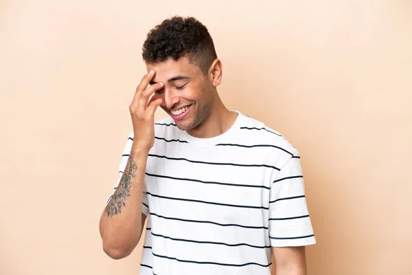 Young Brazilian Man Isolated Beige Background Laughing — Stock fotografie