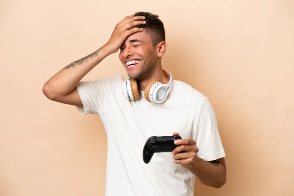 Young Brazilian Man Playing Video Game Controller Isolated Beige Background — 스톡 사진