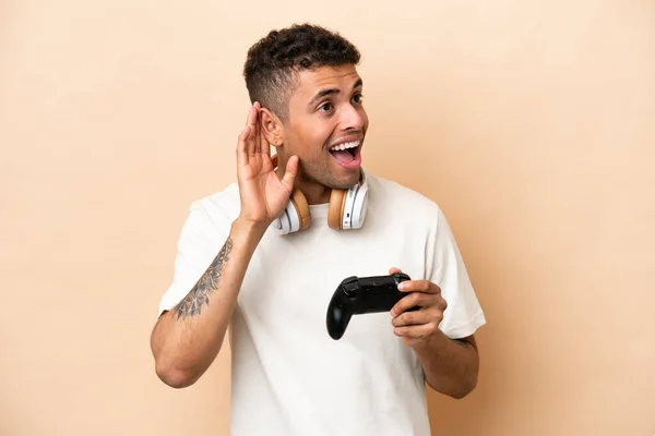 Young Brazilian Man Playing Video Game Controller Isolated Beige Background — Stockfoto