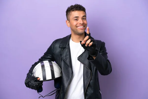 Young Brazilian Man Motorcycle Helmet Isolated Purple Background Showing Lifting — Stockfoto