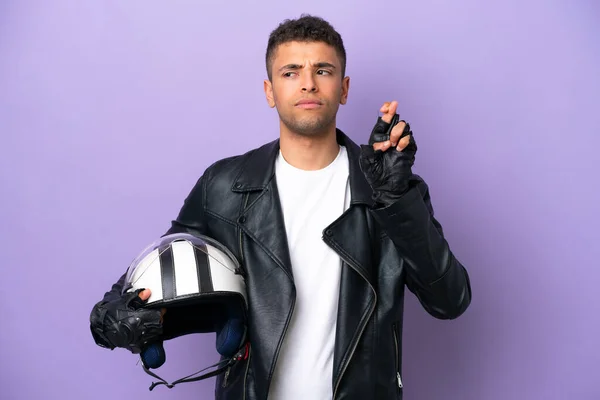 Young Brazilian Man Motorcycle Helmet Isolated Purple Background Fingers Crossing — Φωτογραφία Αρχείου