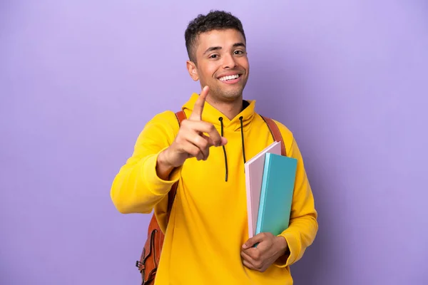 Young Student Brazilian Man Isolated Purple Background Showing Lifting Finger — 스톡 사진