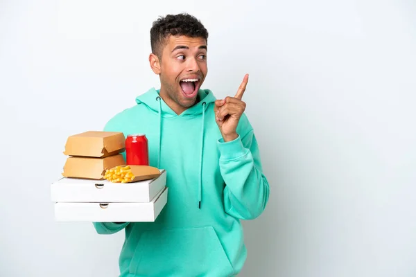 Young Brazilian Holding Fast Food Isolated White Background Intending Realizes — Φωτογραφία Αρχείου