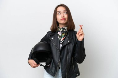 Motosiklet kasklı genç Ukraynalı kadın beyaz arka planda izole edilmiş ve şans diliyor.