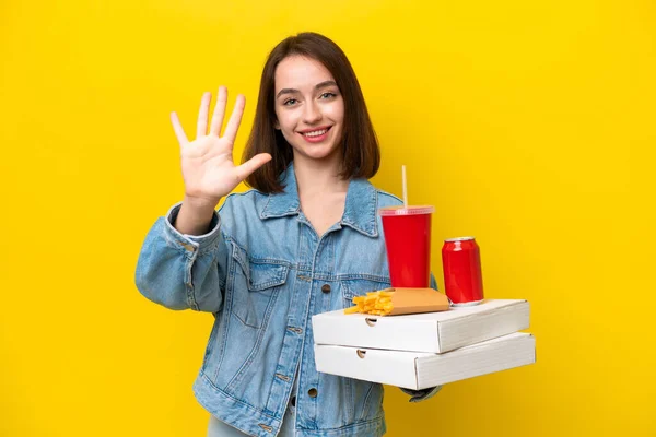Young Ukrainian Woman Holding Fast Food Isolated Yellow Background Counting — Stock Photo, Image