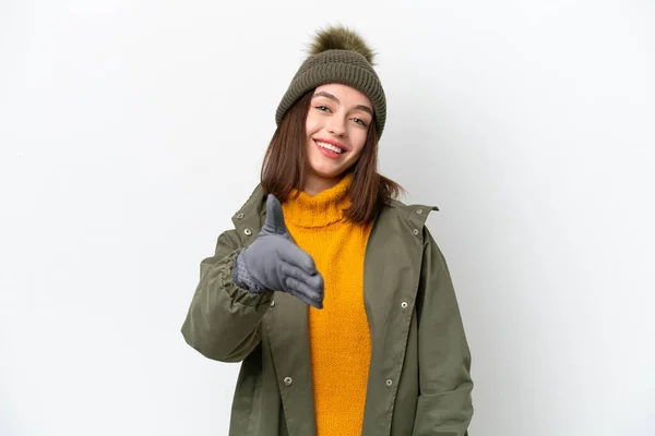 Jovem Ucraniana Usando Casaco Inverno Isolado Fundo Branco Apertando Mãos — Fotografia de Stock