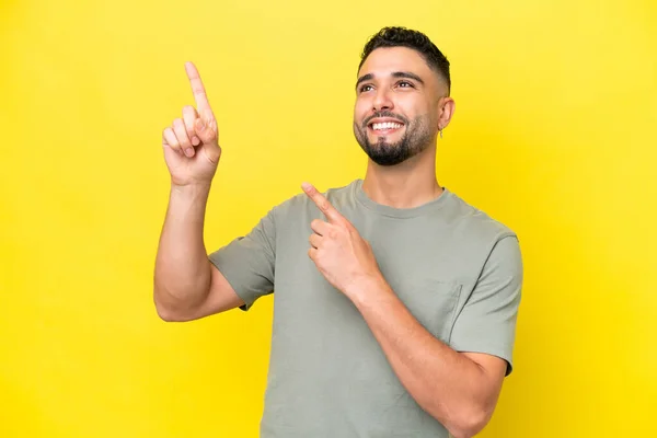 Young Arab Handsome Man Isolated Yellow Background Pointing Index Finger — стоковое фото