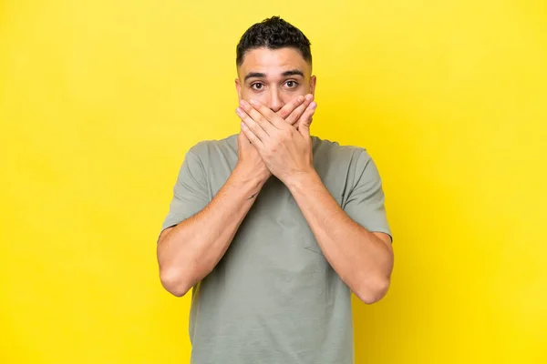 Young Arab Handsome Man Isolated Yellow Background Covering Mouth Hands — Photo