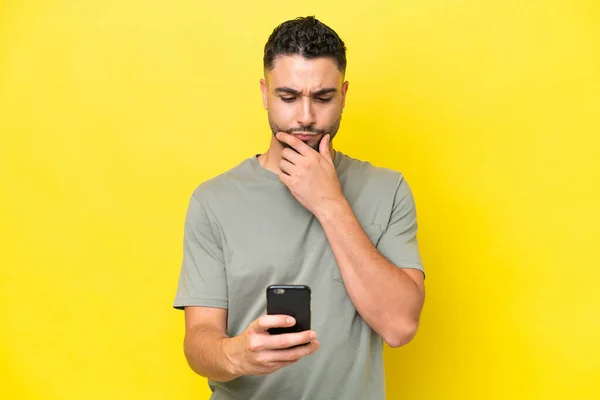 Young Arab Handsome Man Isolated Yellow Background Thinking Sending Message — 스톡 사진