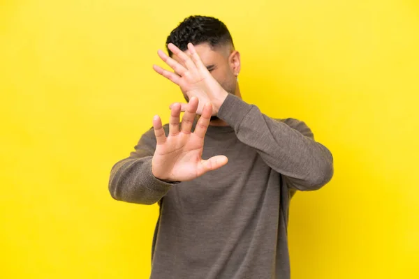 Young Arab Handsome Man Isolated Yellow Background Nervous Stretching Hands — Foto de Stock