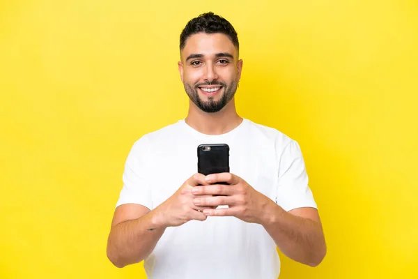 Young Arab Handsome Man Isolated Yellow Background Looking Camera Smiling — Stock fotografie