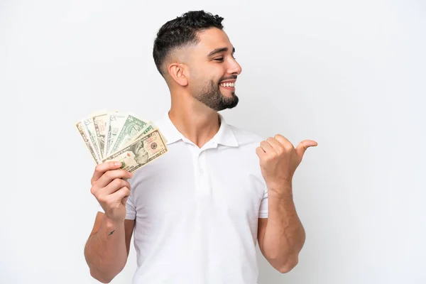Young Arab Man Taking Lot Money Isolated White Background Pointing — Φωτογραφία Αρχείου