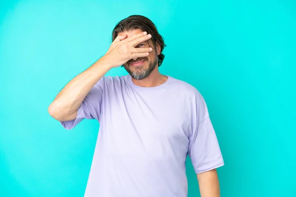 Senior Dutch Man Isolated Blue Background Covering Eyes Hands Smiling — Stock Photo, Image