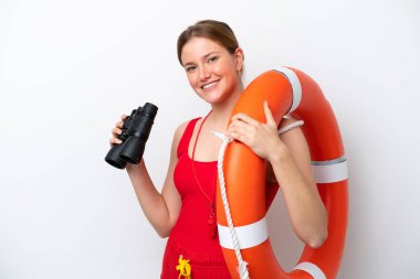 Young caucasian woman isolated on white background with lifeguard equipment and with binoculars