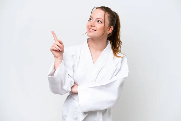 Young Caucasian Girl Doing Karate Isolated White Background Pointing Great — Stock Photo, Image