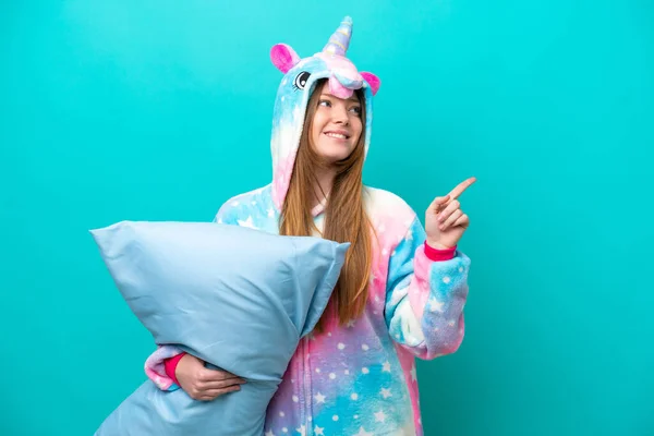 Young Caucasian Girl Unicorn Pajamas Holding Pillow Isolated Blue Background — Stock Photo, Image