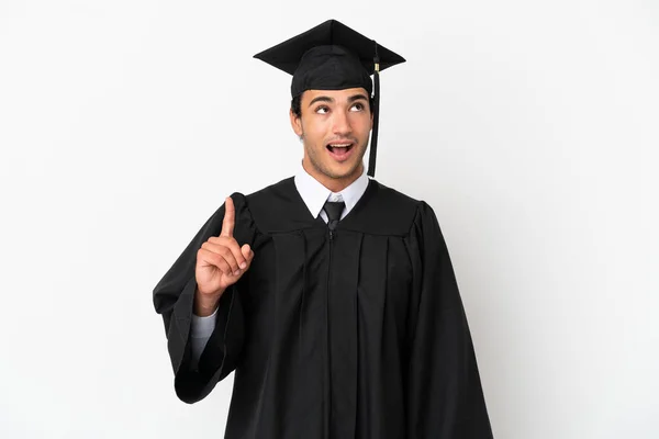 Jonge Afgestudeerde Universiteit Geïsoleerde Witte Achtergrond Wijzen Verrast — Stockfoto