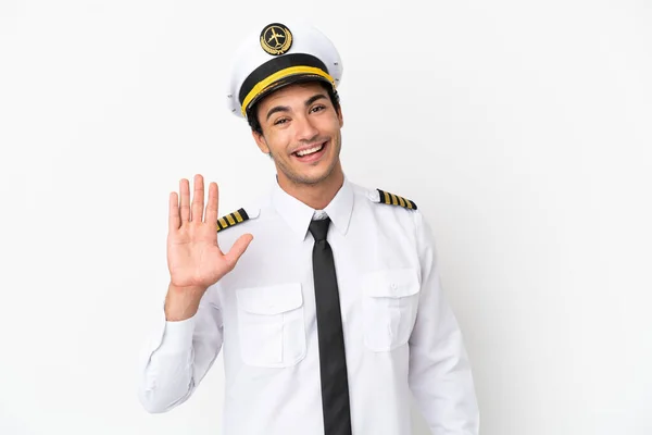 Pilot Samolotu Nad Odizolowanym Białym Tłem Salutując Ręką Szczęśliwym Wyrazem — Zdjęcie stockowe