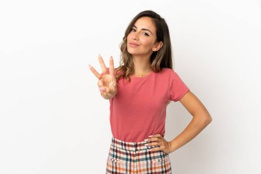 Young woman over isolated background happy and counting three with fingers clipart