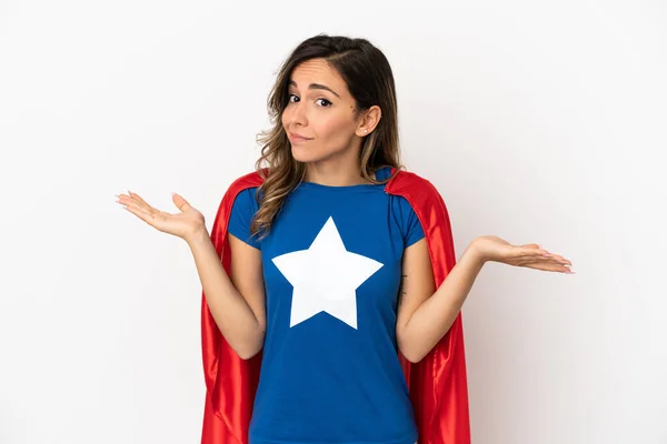 Super Hero woman over isolated white background having doubts while raising hands