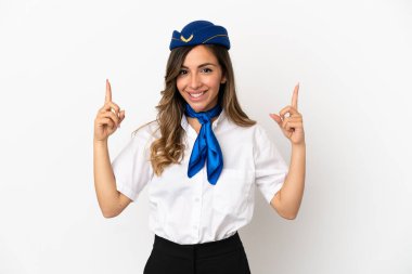 İzole edilmiş beyaz arka planda uçak hostesi harika bir fikre işaret ediyor.