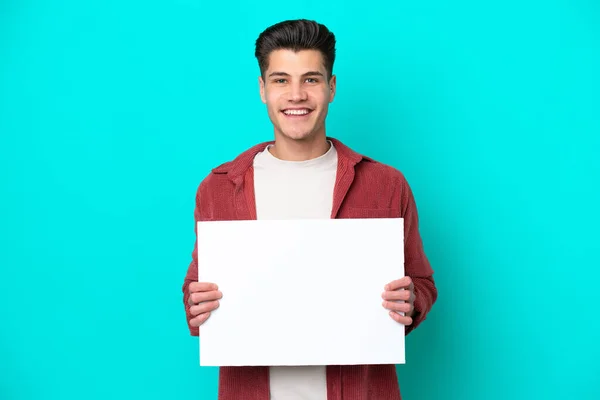 Young Handsome Caucasian Man Isolated Blue Bakcground Holding Empty Placard — Stock Photo, Image