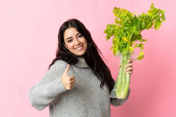 Young Caucasian Woman Holding Celery Isolated Blue Background Thumbs Because — Stock Photo, Image