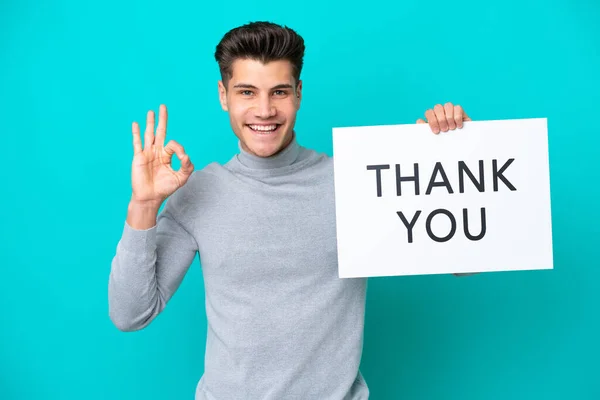 Young Handsome Caucasian Man Isolated Blue Bakcground Holding Placard Text — 스톡 사진