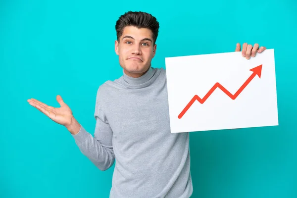 Young Handsome Caucasian Man Isolated Blue Bakcground Holding Sign Growing — Stock Photo, Image