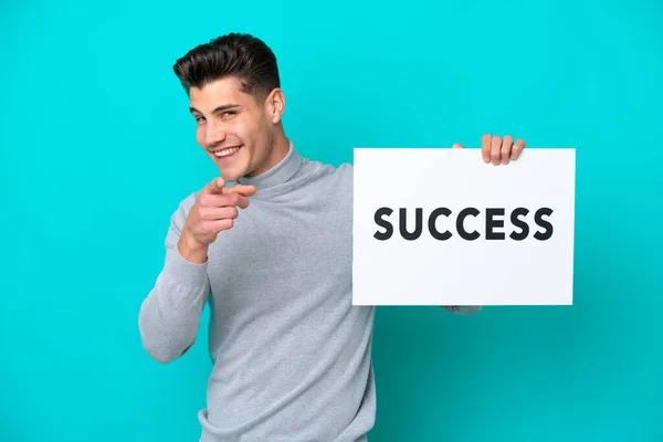 Young Handsome Caucasian Man Isolated Blue Bakcground Holding Placard Text — Stock Photo, Image