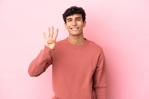 Jonge Argentijnse Man Geïsoleerd Roze Achtergrond Gelukkig Tellen Vier Met — Stockfoto