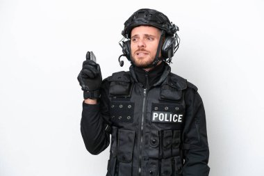 Brazilian soldier man isolated on white background keeping a conversation with the mobile phone