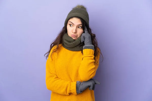 Teenager Russian Girl Winter Hat Isolated Purple Background Thinking Idea — Stock fotografie