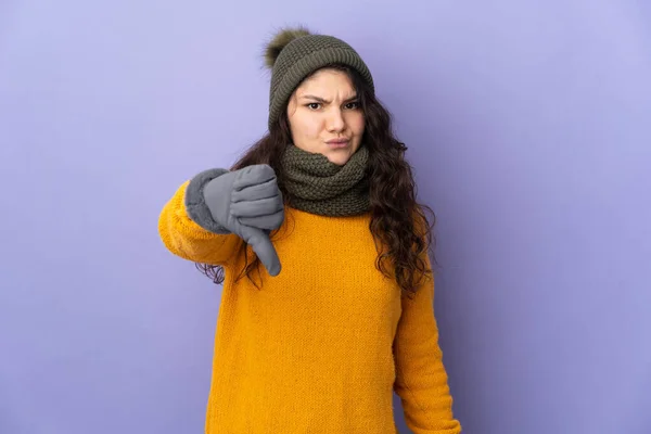 Teenager Russian Girl Winter Hat Isolated Purple Background Showing Thumb — Zdjęcie stockowe